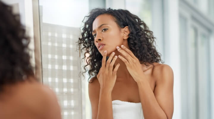 concerned woman touching face